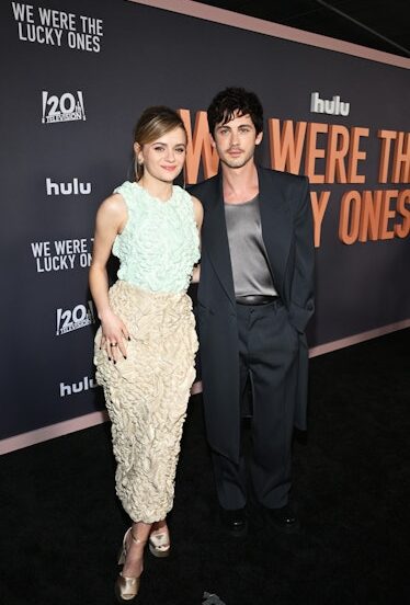 Joey King & Logan Lerman's 'We Were The Lucky Ones' Premiere Looks Remix The Classics