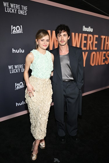 Joey King & Logan Lerman's 'We Were The Lucky Ones' Premiere Looks Remix The Classics