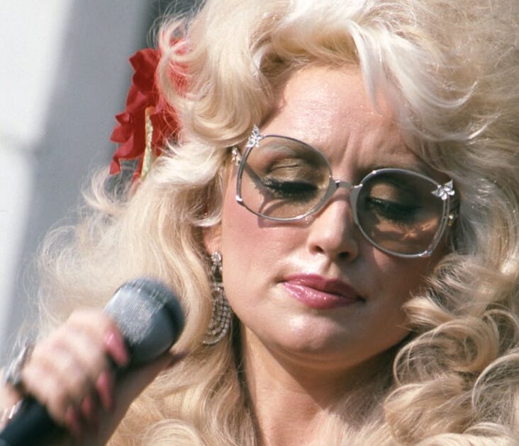 A Visual History of Dolly Parton’s Boldest Bedazzled Looks