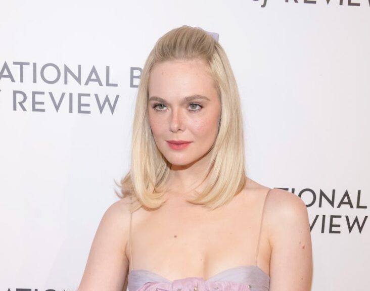 Elle Fanning Pairs a Baby-Doll Dress With Faux Fur and Blinding Rubies