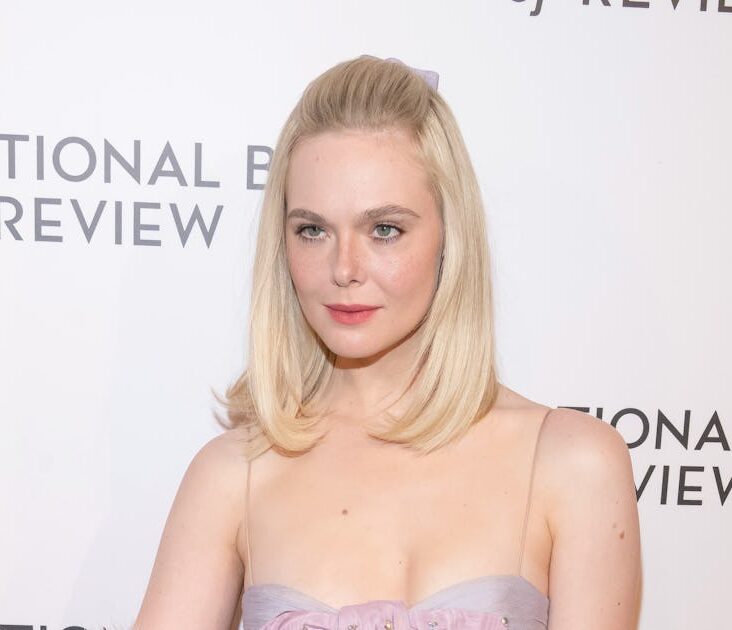 Elle Fanning Pairs a Baby-Doll Dress With Faux Fur and Blinding Rubies